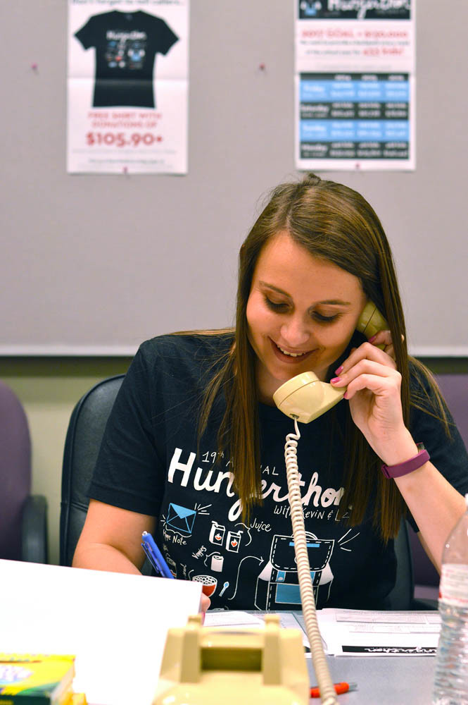 Dinner is Served
Ozarks Food Harvest and iHeartMedia’s 19th annual Hungerthon raised $135,209 Sept. 8-11 for The Food Bank’s Weekend Backpack Program. Above, Julie Daoust, OFH’s retail store donation specialist, works the phones donations during the 30-hour drive. With this year’s results, 451 at-risk children will have nutritious meals to take home every Friday after school.