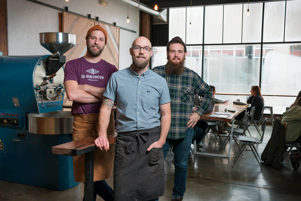 ROASTING KINGS: Mason Jones and Chris McGuire, from left, join Isaac Neale at Kingdom Coffee to run its new roasting machine.