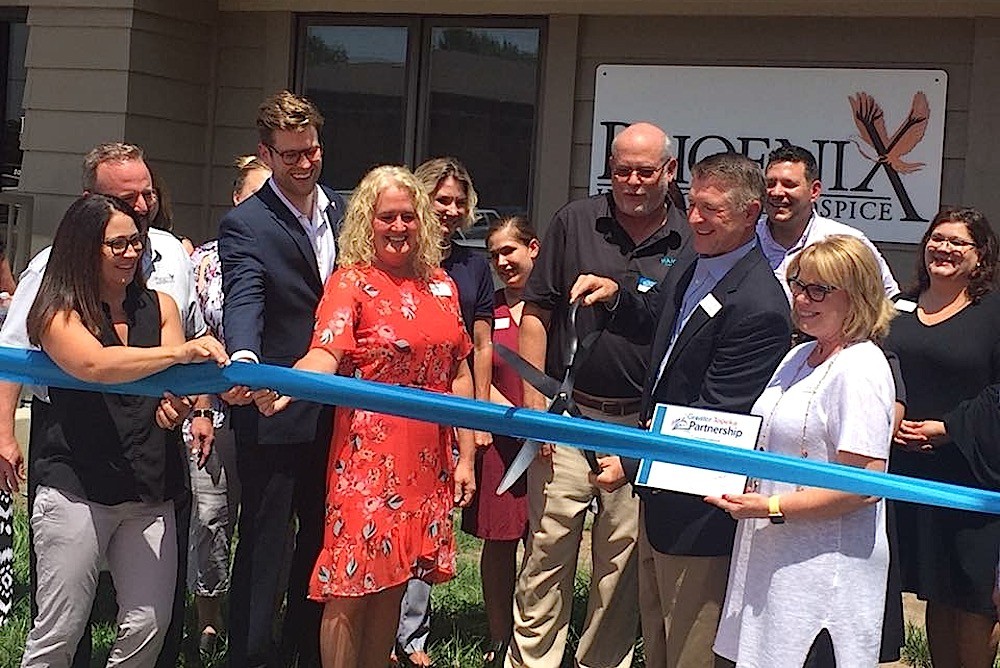 Phoenix Home Care Inc. owner and CEO Phil Melugin cuts the ribbon on the company’s Topeka, Kansas, office.