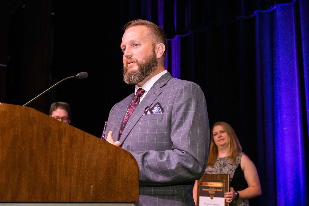 Hurts Donut Co. co-owner Tim Clegg accepts the top honor in the one to five years in business category.
