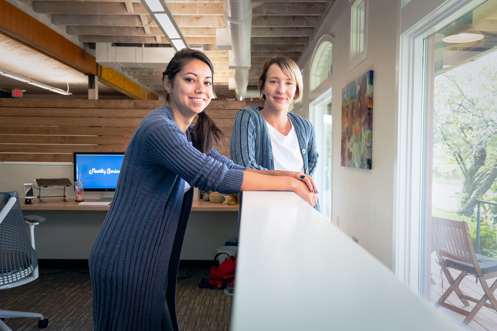 NEW DIGS: Becca Godsey, left, and Molly Riddle-Nunn of Mostly Serious develop digital marketing content for clients out of the agency’s new location on Line Pine Avenue.