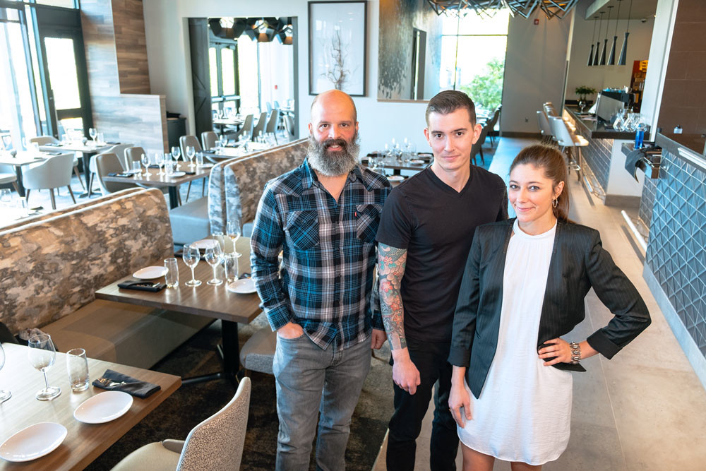 COMMUNITY MEALS: With two years of executing pop-up dinner events under their belt, Progress co-owners, from left, Michael Schmitz, Daniel Ernce and Cassidy Rollins now run a brick-and-mortar restaurant in Farmers Park.