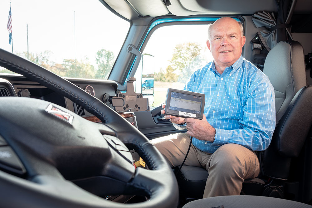 TransLand CEO Mark Walker displays one of the electronic logging devices installed in most of its 200-truck fleet.