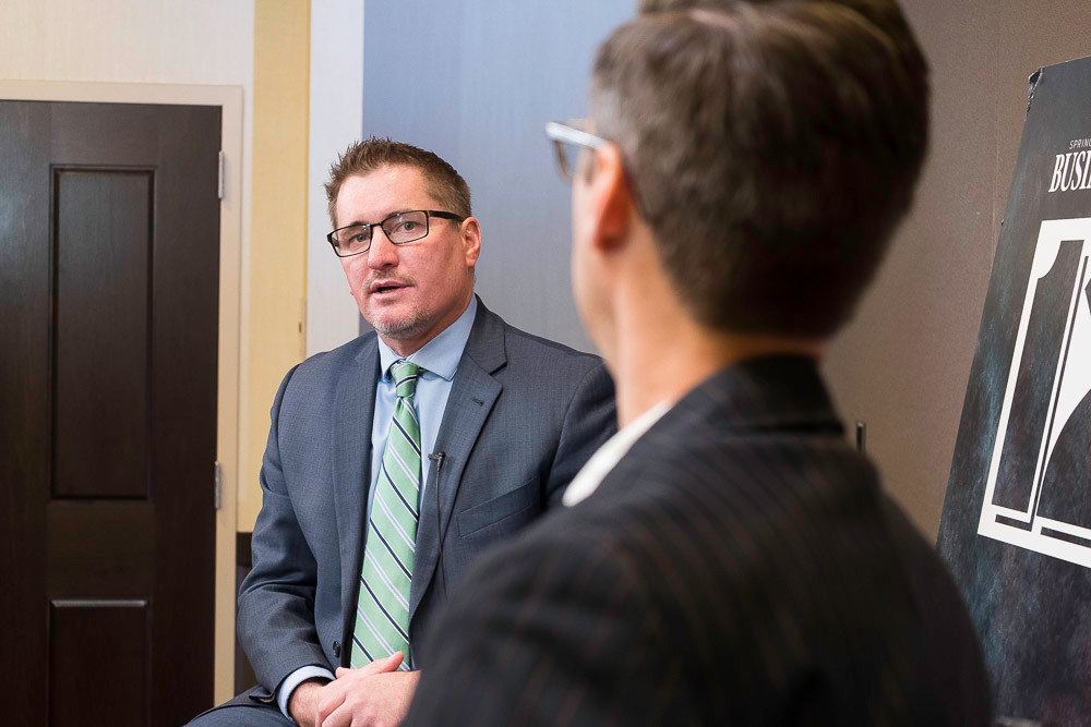 SBJ Editor Eric Olson interviews Burrell CEO C.J. Davis at the monthly 12 People breakfast.