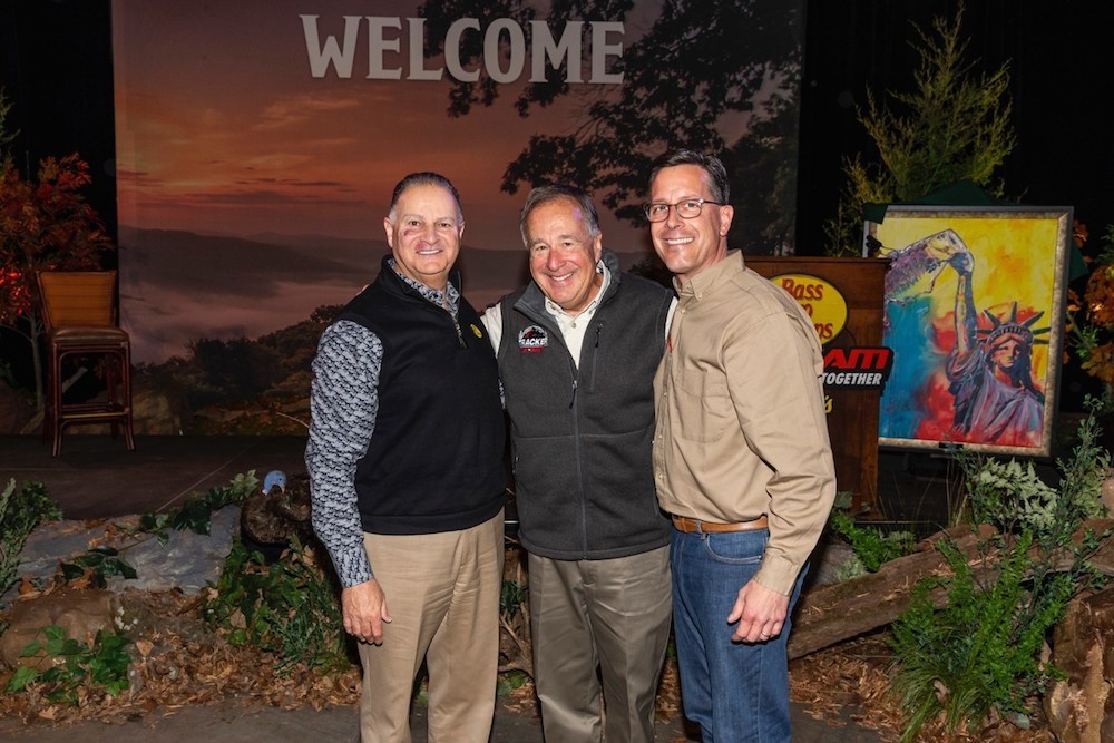 Bass Pro founder Johnny Morris, center, poses with Jim Hagale, left, and Michael McDermott.