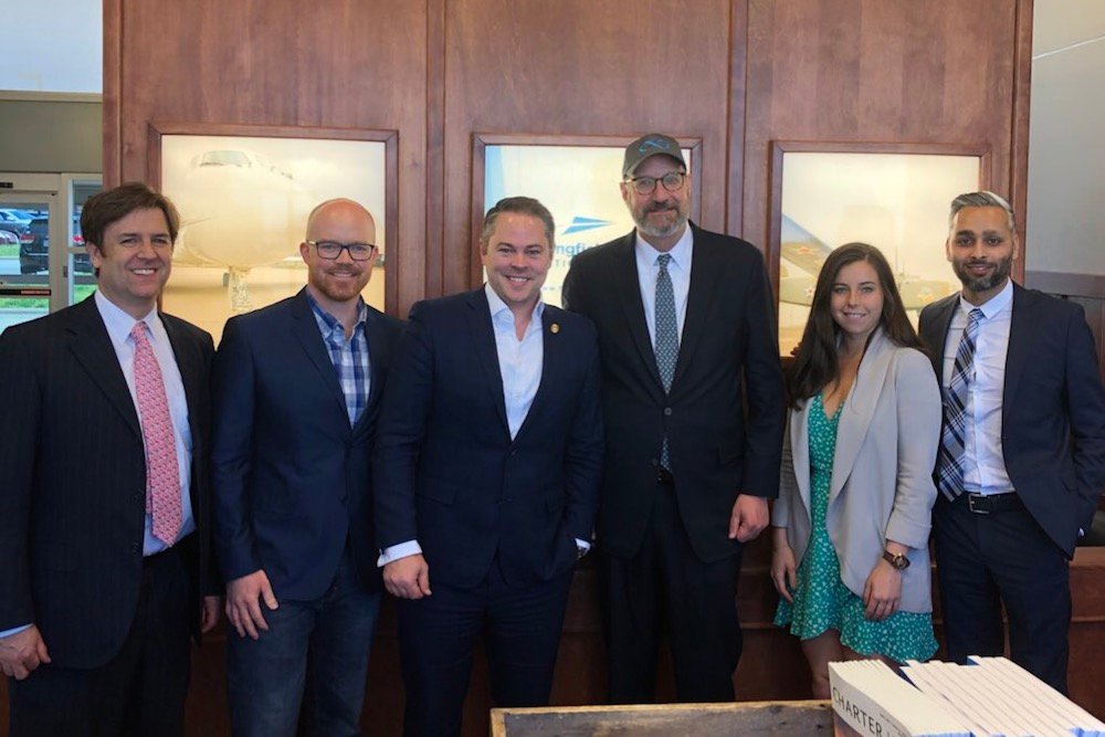 Haahr, third from left, and Rep. Travis Fitzwater, second from left, pose with Walder, third from right, and other Virgin Hyperloop officials.