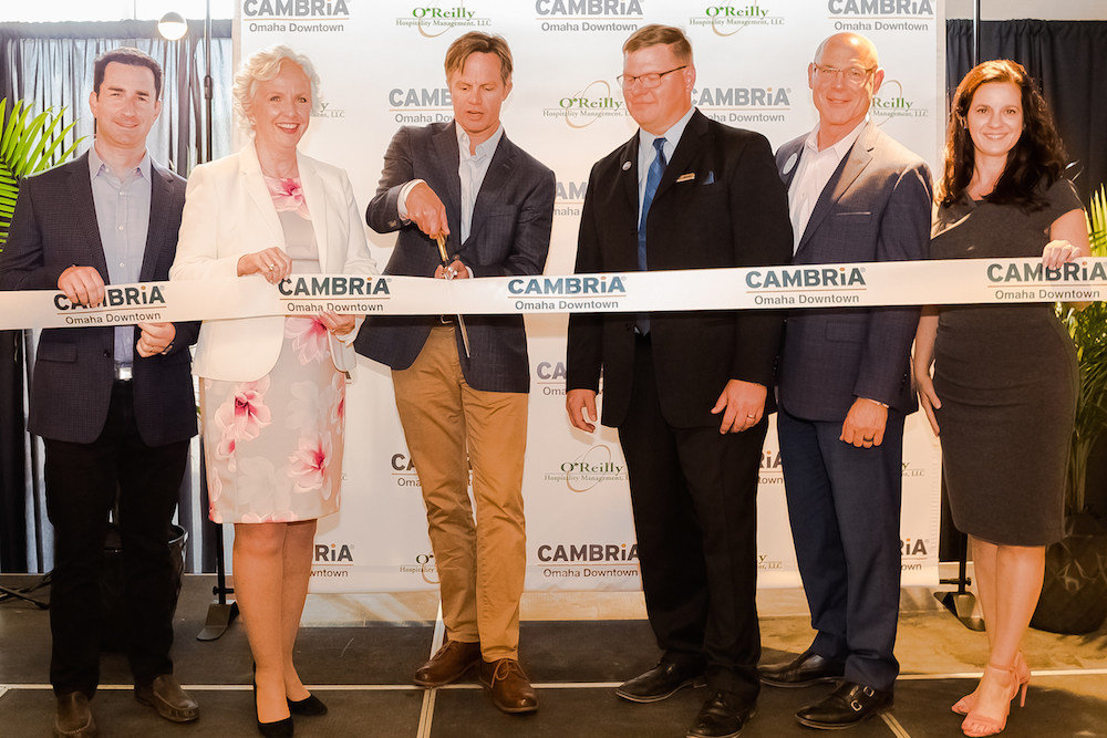 Tim O’Reilly, third from left, cuts the ribbon on O’Reilly Hospitality Management’s fourth Cambria.